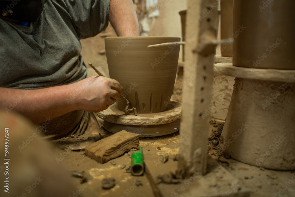 Handmade clay pot made by hand on manual lathe Handmade clay pot made by hand on manual lathe