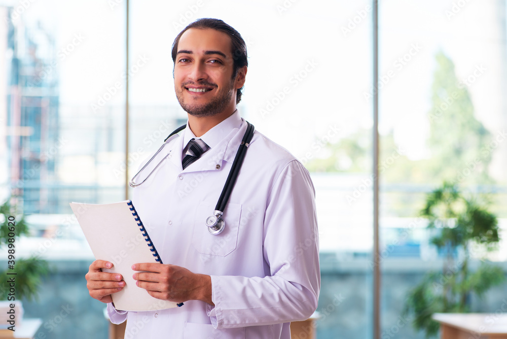 Young male medic working in the clinic Young male medic working in the clinic