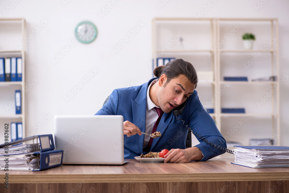 Young businessman working in the office Young businessman working in the office