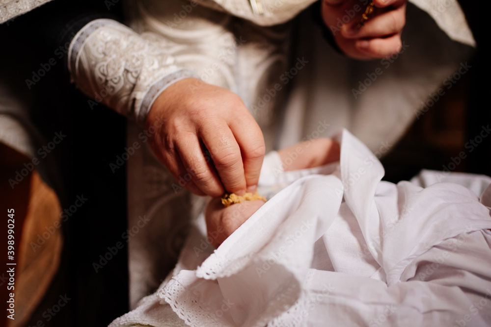 Confirmation. infant baby at the ritual of baptism in the Orthodox Church. Confirmation. infant baby at the ritual of baptism in the Orthodox Church.