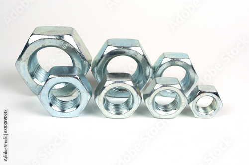 galvanized metal nuts of different sizes close-up