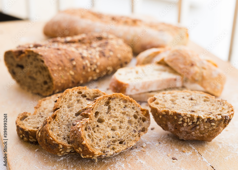 fresh loaf of bread on wooden board