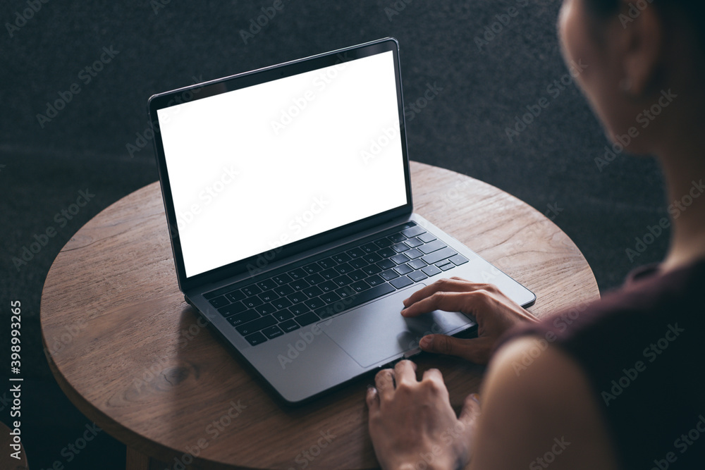 © panitan - computer screen blank mockup.hand woman work using laptop with white background for advertising,contact business search information on desk at coffee shop.marketing and creative design