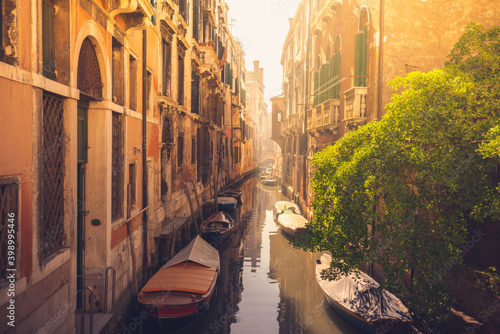 Venetian water canal with morning mist 