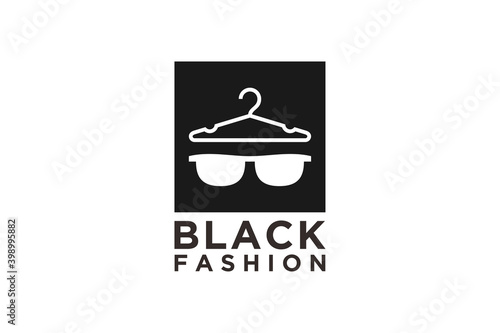 Fashion store logo, hanger glases silhouette cimple m inimalist icon. photo