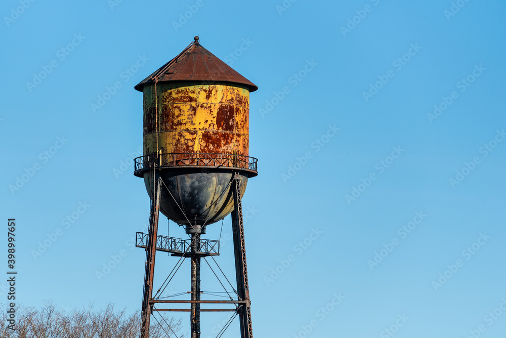 Historic Semiahmoo Water Tower, classic rusted round water tank on a sunny blue day
