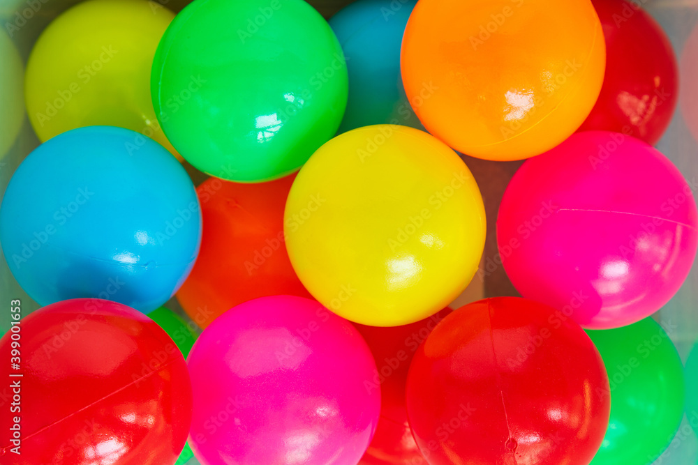 Top view of a group of multi color plastic ball in a plastic box Top view of a group of multi color plastic ball in a plastic box