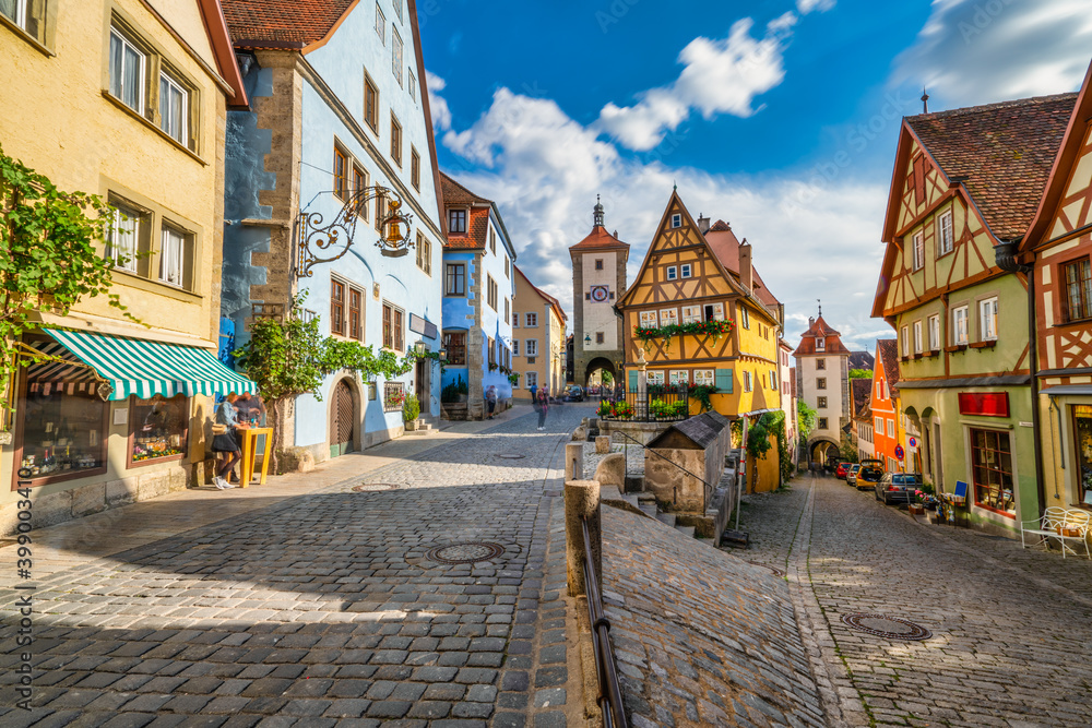 Traditional German architecture of Rothenburg ob der Tauber city with timbered houses in morning light. Bavaria, Germany
