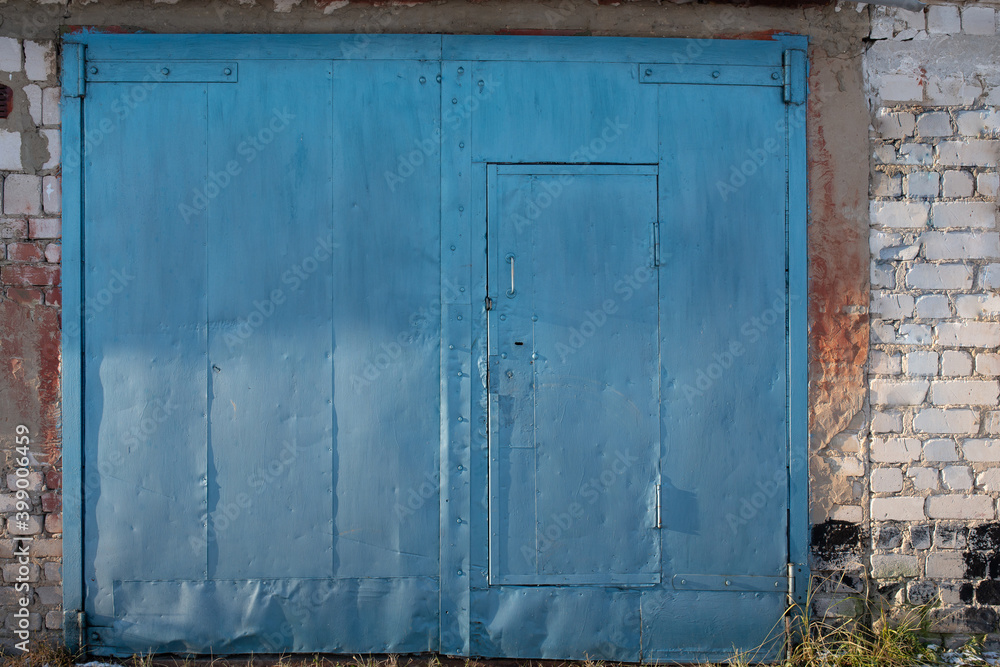 Fototapeta premium iron garage doors with peeling paint