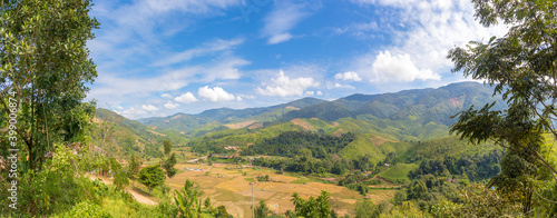 Panorama landscape of mountain forest with blue sky and white cloud at Spun, Nan Province, Thailand, Asia.