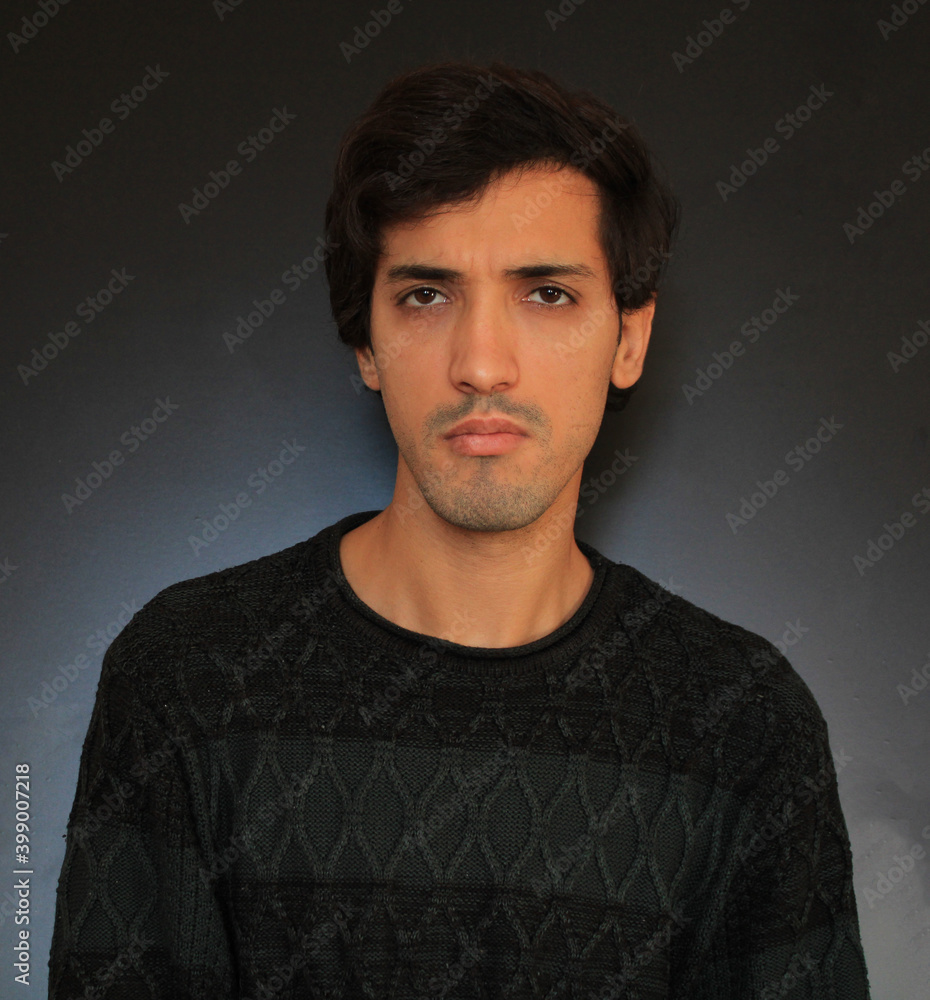Fototapeta premium Depressed man, angry man looking bad black background