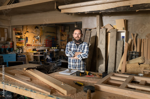 Small business carpenter working in craft studio.