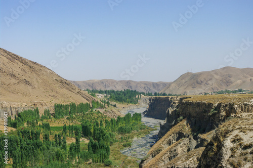 View of Shahristan river canyon near Bunjikat sogdian ruins in Sughd region, Tajikistan photo