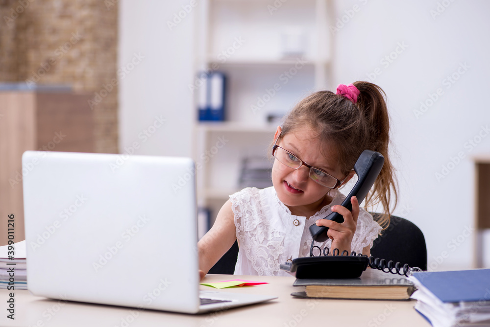 Funny small girl accountant working in the office Funny small girl accountant working in the office