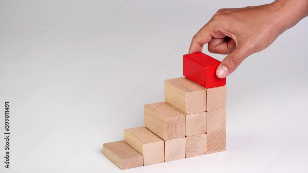 Business growth, building success, ladder career path foundation concept, Hand arranging wooden block stacking as step stair. Copy space. Business growth, building success, ladder career path foundation concept, Hand arranging wooden block stacking as step stair. Copy space.