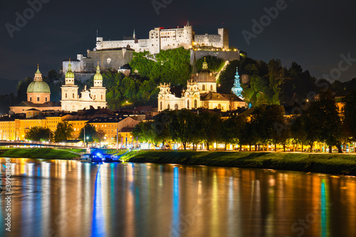 Salzburg at night. City skyline with Festung Hohensalzburg castle, Austria