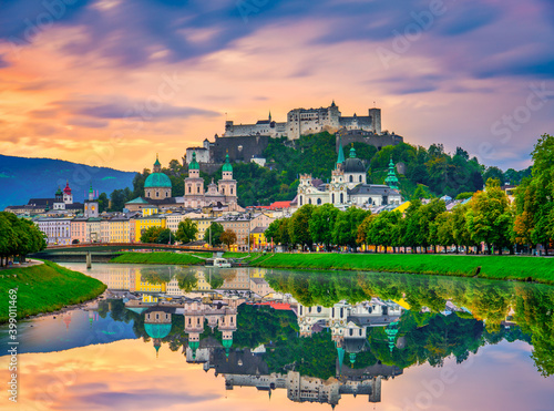 Salzburg sunrise skyline with Festung Hohensalzburg fortress and reflection. Austria