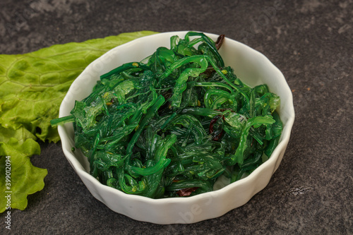 Green Chuka Seaweed Salad Isolated on White Background Top View. Wakame Sea Kelp Salat