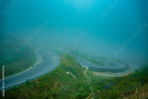  road in the mountains with blue sky on the background at Ha Giang province, Viet Nam