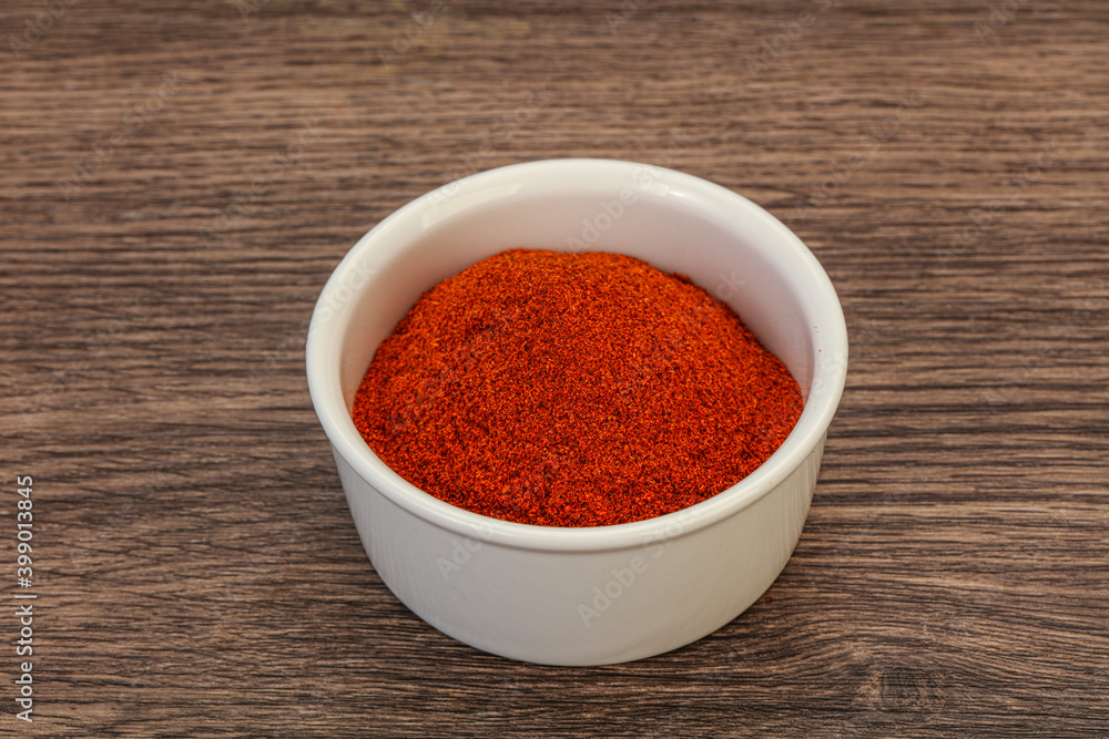 Dry paprika powder in the bowl Dry paprika powder in the bowl