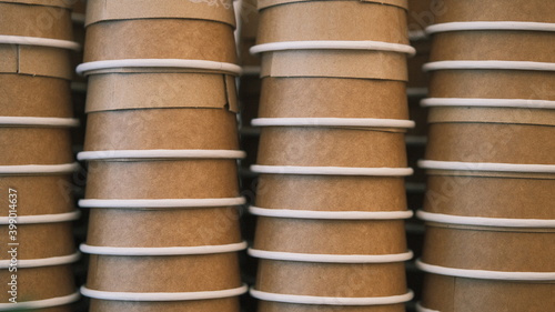 stacked paper cups ready for coffee at the cafe