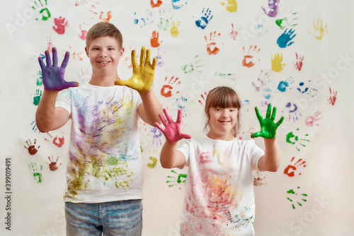Εκτύπωση καμβά Happy kids, disabled boy and girl with Down syndrome smiling at camera, showing