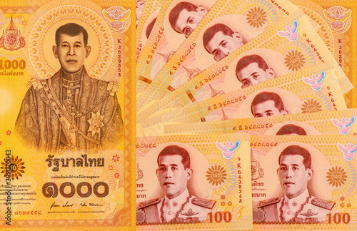 New currency of Thailand Baht 100 and 1000 Limited edition for The meaningful images reflecting the Royal Coronation Ceremony in 2019. Bangkok Thailand December 12, 2020. Thailand Baht Banknotes. photo
