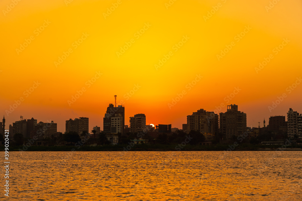 Sunset on the skyline of the city of Cairo, the sun goes down on the buildings of the city of Cairo in the background. Africa