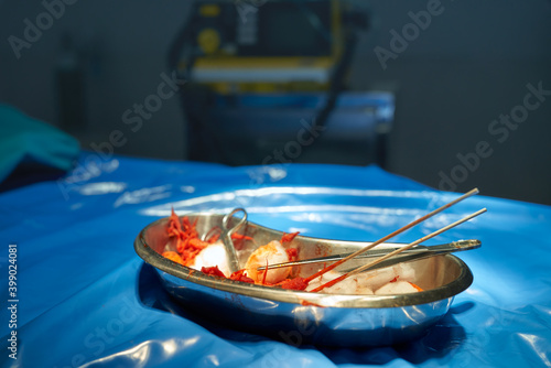 dressing set instrument or wound cleaning equipment on table and blood in stainless tray in surgical room hospital photo