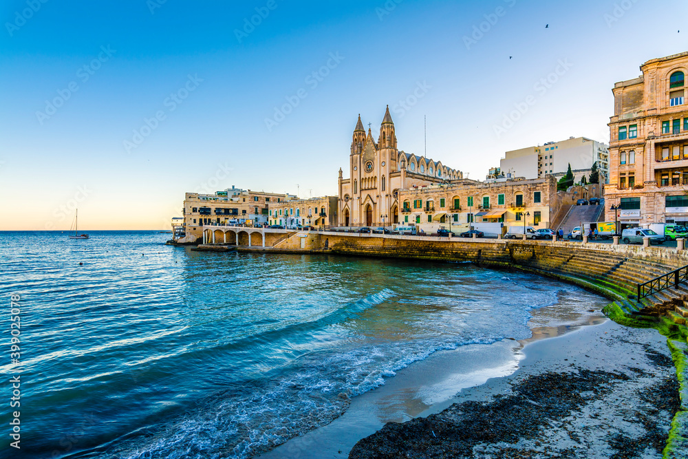 Our Lady of Mount Carmel Church on Balluta Bay in St. Julian's, Malta. St Julians is populer tourist destination in Malta.
