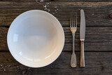 Empty plate on wooden table
