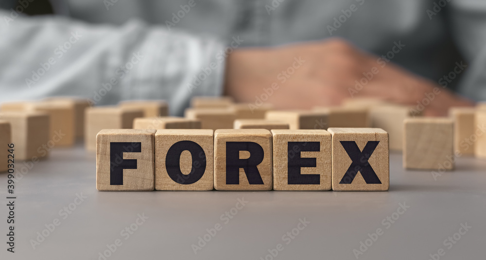 Naklejka premium The word FOREX made from wooden cubes. Shallow depth of field on the cubes