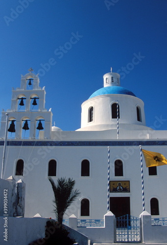 View of Santorini blue domed church and Church bells in Santorini, Greece. 