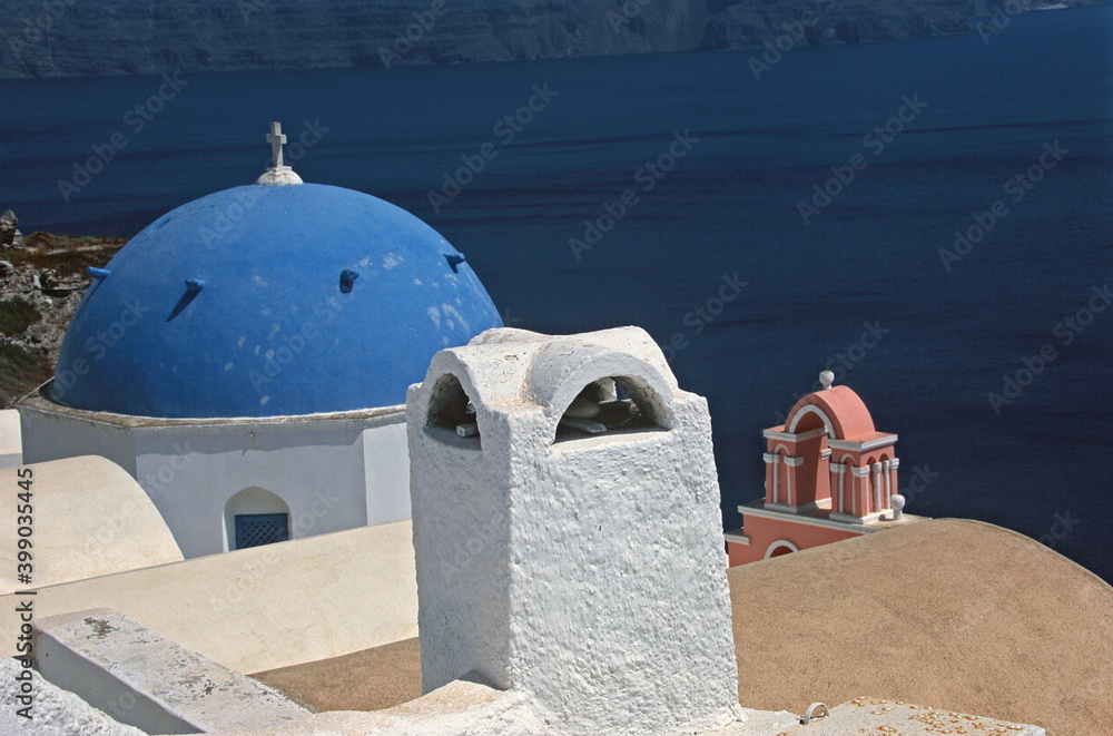 Φωτογραφία View of Santorini blue domed church and Church bells with  caldera in Santorini, Greece