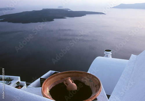 View of Santorini blue color sea and caldera with white house roof and balcony in Santorini, Greece. 