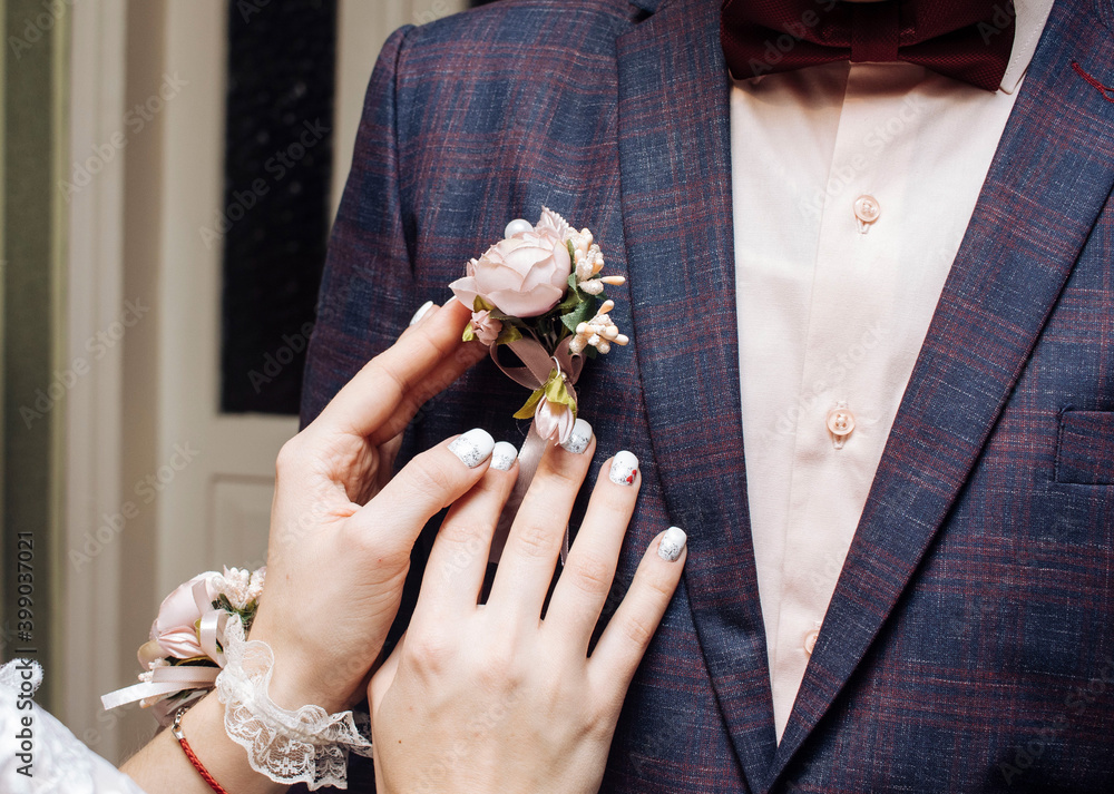 the bride clings to a floral attribute on the groom the bride clings to a floral attribute on the groom