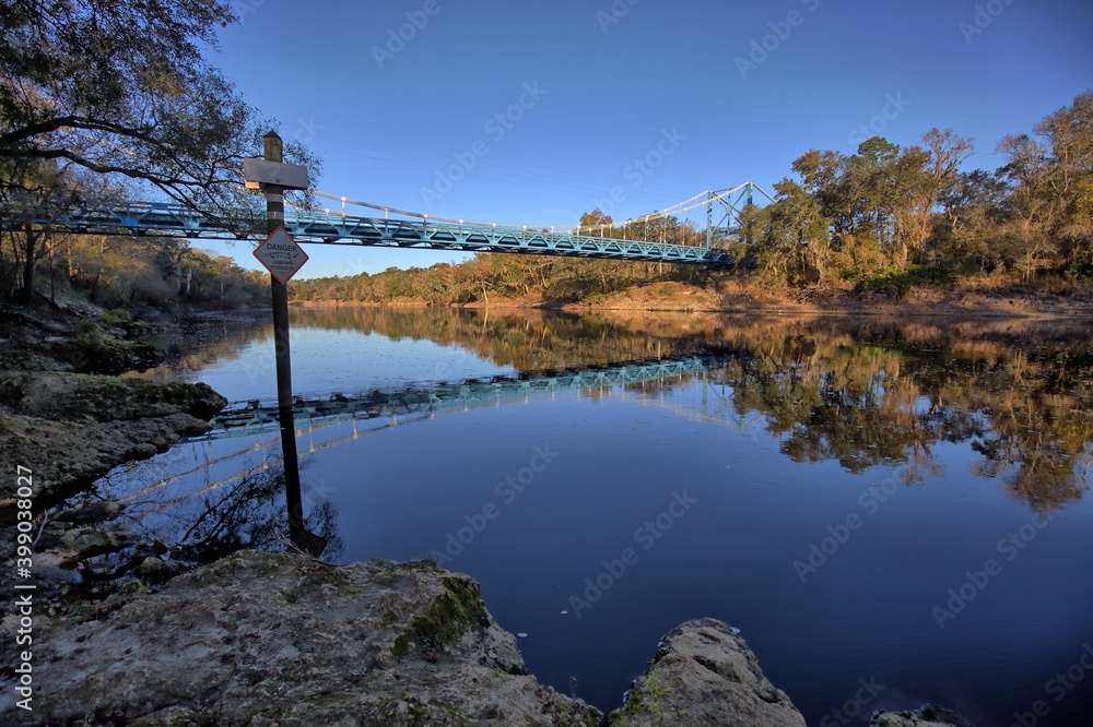 Bridge crossing the Suwannee River with reflection.