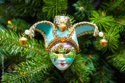Fototapeta Naklejka Na Ścianę i Meble -  Christmas tree decoration colorful Venetian carnival mask.