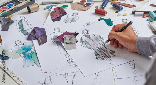 Fashion designer stylish drawings sketches textile fabric material Costume. Designer creative workshop studio.