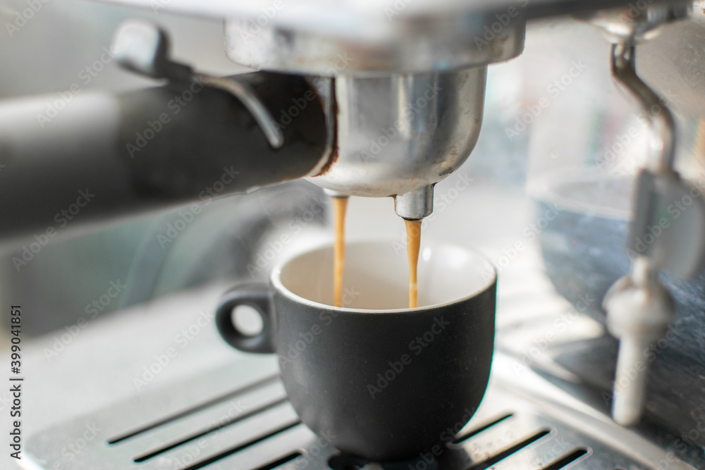Preparing freshly ground espresso in a coffee machine Preparing freshly ground espresso in a coffee machine