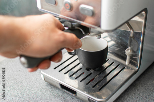 Preparing freshly ground espresso in a coffee machine