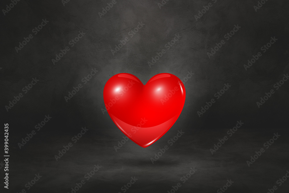 3D red heart on a black studio background 3D red heart on a black studio background