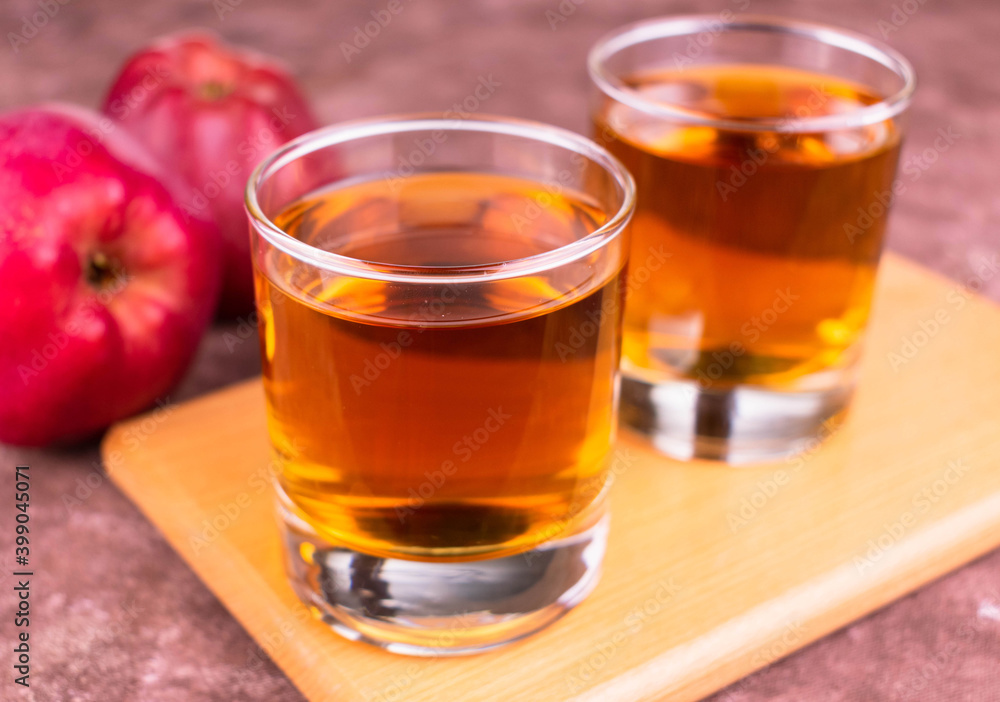 Two glasses of red apple. Concentration of organic products.