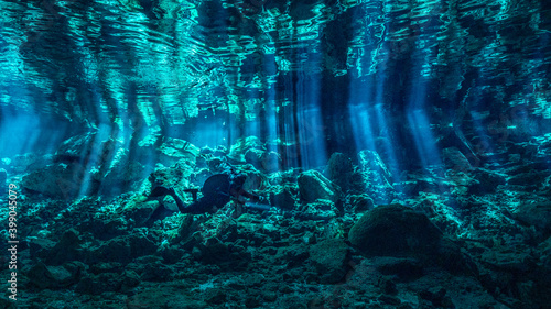 Cenote Dos Ojos with light rays Underwater in Yucatan, Mexico