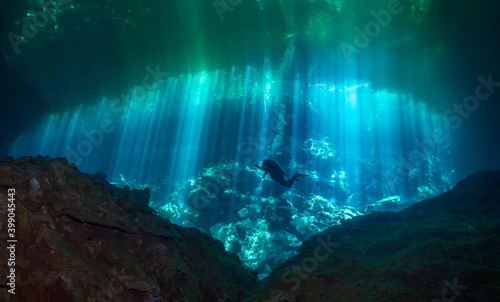 Cenote Ponderosa with light rays Underwater in Yucatan, Mexico