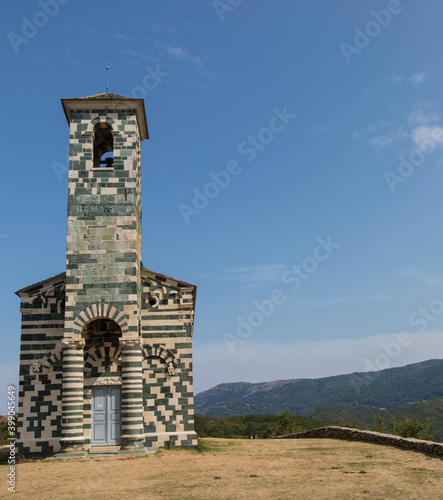 View of the famous Church of San Michele de Murato, a small chapel in polychrome stones and typical pisan romanesque style in village of Murato, Haut-Corse, France