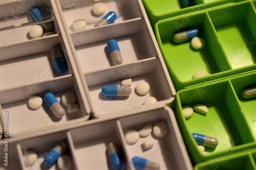 Fototapeta Naklejka Na Ścianę i Meble -  Close up of different pills prepared in tablets boxes