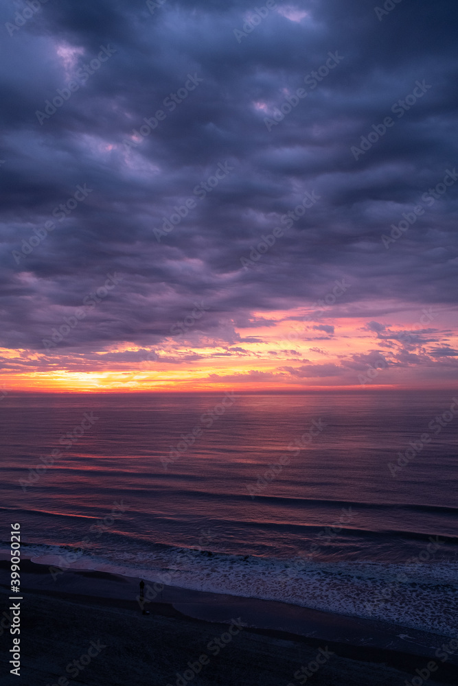 Beautiful Sunrise over the Ocean with Dramatic Clouds