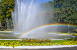 RAINBOW IN THE BACKGROUND OF THE FOUNTAIN