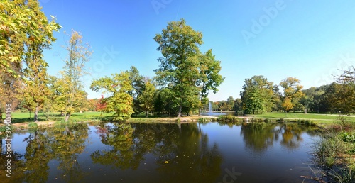 Autumn in Stromovka Park, Prague, Czech Republic. Pond in the foreground, colorful trees around.